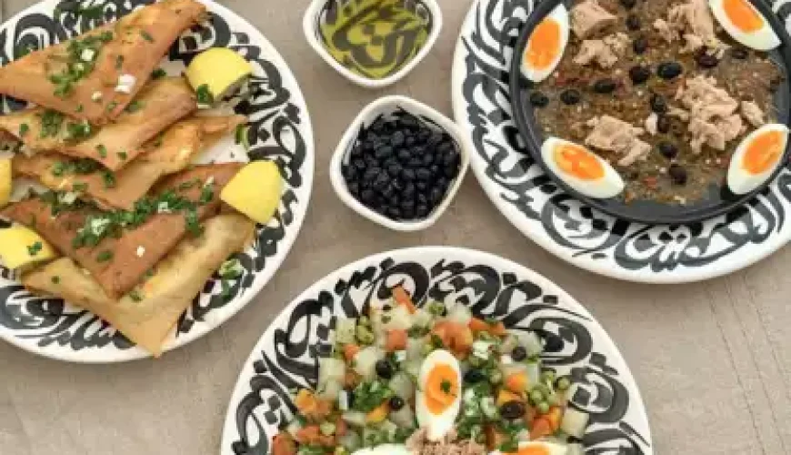 Traditional Tunisian dishes served on a table with colorful deco