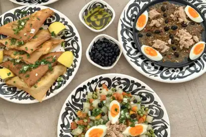 Traditional Tunisian dishes served on a table with colorful deco